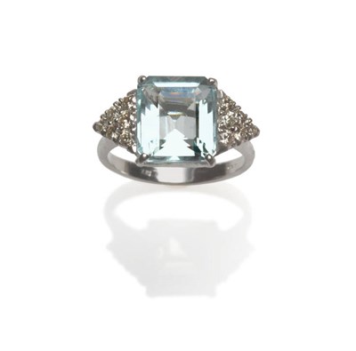 Lot 86 - An 18 Carat White Gold Aquamarine and Diamond Ring, the step cut aquamarine in a four claw setting
