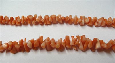 Lot 89 - A Coral Necklace, branch coral of pale pink to peach in colour as a single strand, length 51cm
