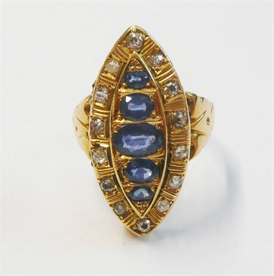 Lot 92 - A Sapphire and Diamond Navette Cluster Ring, five graduated oval mixed cut sapphires within a...