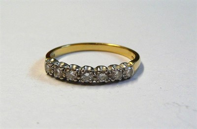 Lot 95 - An 18 Carat Gold Diamond Half Eternity Ring, the seven round brilliant cut diamonds in white...
