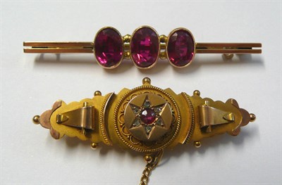 Lot 103 - An Early 20th Century 9 Carat Gold Bar Brooch, a central star formation of ruby and diamonds within
