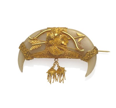 Lot 105 - A Double Tiger's Claw Brooch, with filigree overlay depicting a bird over a bow and arrow and...