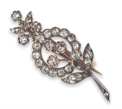 Lot 111 - A Victorian Diamond Floral Spray Brooch, the old cut diamonds in white claw and collet settings...