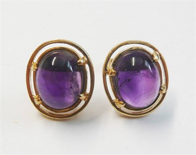 Lot 118 - A Pair of Amethyst Stud Earrings, each with an oval cabochon amethyst in yellow claw settings,...