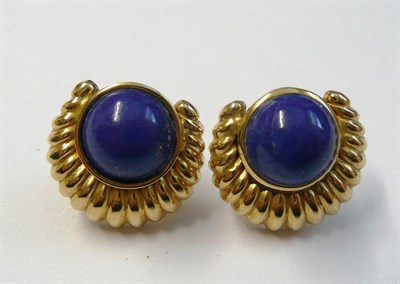 Lot 120 - A Pair of Lapis Lazuli Earrings, a scalloped crescent form surrounds a circular cabochon lapis...