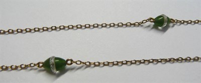 Lot 123 - A Necklace, of fine trace link, with two gem spacers, each comprises a faceted rock crystal...