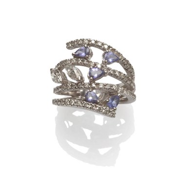 Lot 129 - A Tanzanite and Diamond Ring, two marquise cut diamonds, and pear cut tanzanites in white claw...
