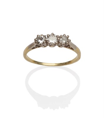 Lot 144 - A Diamond Three Stone Ring, circa 1930, the graduated round brilliant cut diamonds in white...