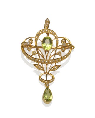 Lot 145 - An Early 20th Century Peridot and Seed Pearl Brooch/Pendant, an oval cut peridot within a seed...