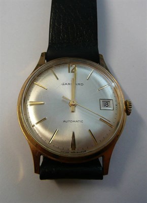 Lot 158 - A 9ct Gold Automatic Calendar Centre Seconds Wristwatch, signed Garrard, 1971, lever movement,...