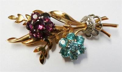 Lot 160 - A 9 Carat Gold Spray Brooch, of double floral spray form, one flower cluster of blue zircon, one of