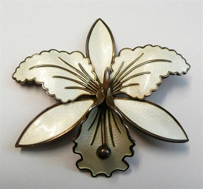 Lot 161 - An Enamelled Norwegian Brooch, in the form of an orchid, enamelled in white, measures 7cm by 6.6cm