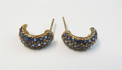 Lot 169 - A Pair of Sapphire Set Cuff Earrings, round brilliant cut sapphires pavé set into a yellow...