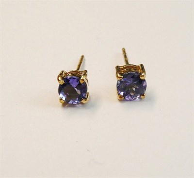 Lot 170 - A Pair of Tanzanite Stud Earrings, the round brilliant cut tanzanites in yellow four claw settings