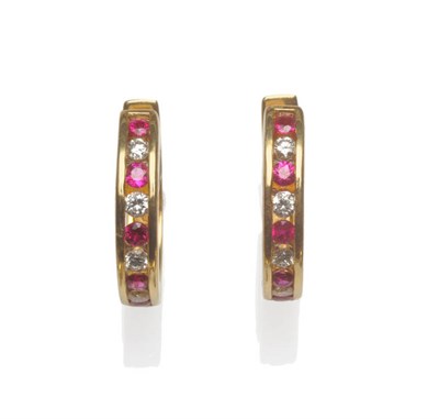 Lot 177 - A Pair of Ruby and Diamond Hoop Earrings, alternating round brilliant cut rubies and diamonds...