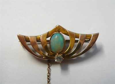 Lot 187 - An Art Nouveau Style Brooch, of pierced batwing form, an oval cabochon opal set centrally, and...