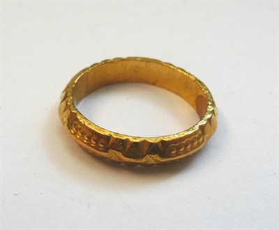Lot 193 - A Ring, a knife edge band, with barrel and cross motifs, and circle details, finger size M