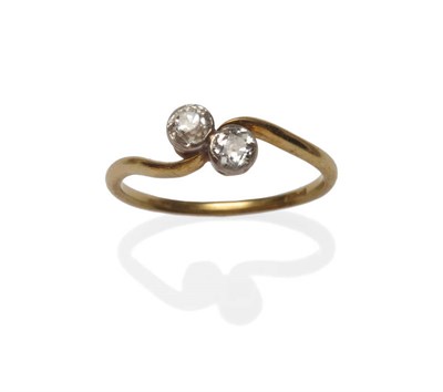 Lot 203 - A Diamond Two Stone Twist Ring, the old cut diamonds in white collet settings on a yellow twist...