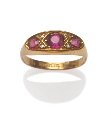 Lot 206 - An Early 20th Century 18 Carat Gold Garnet and Diamond Ring, the three graduated mixed cut...