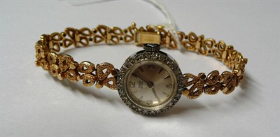 Lot 213 - A Lady's 9ct Gold Tudor Royal Wristwatch, circa 1950, the circular silvered dial signed and...