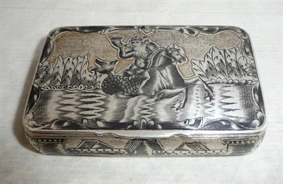 Lot 224 - A 19th Century Russian Niello Decorated Silver Snuff Box, the cover decorated with a bare...