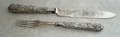 Lot 274 - A Victorian Silver Cake Knife and Fork, Martin, Hall & Co, Sheffield 1884, with fruiting vine...