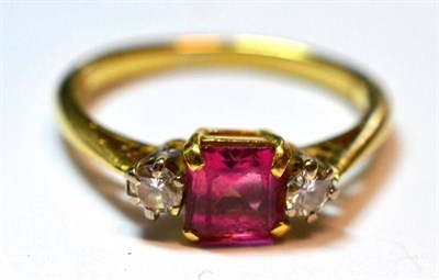 Lot 1002 - An 18 Carat Gold Pink Tourmaline and Diamond Ring, the step cut tourmaline in a yellow four...