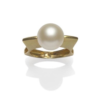 Lot 1014 - An 18 Carat Gold Contemporary South Sea Pearl Ring, the pearl held in a shaped shank, with...