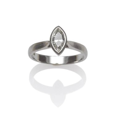 Lot 1022 - A Platinum Marquise Cut Diamond Solitaire Ring, the diamond in a rubbed over setting, to...