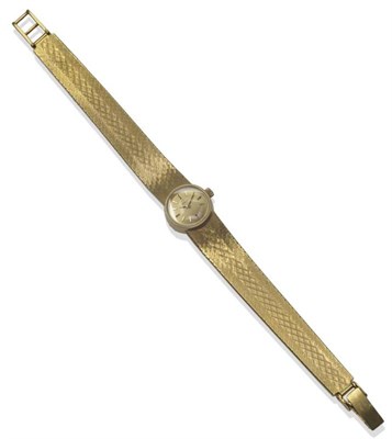 Lot 1026 - A Lady's 18ct Gold Wristwatch, signed Omega, lever movement, gilt dial with applied baton...