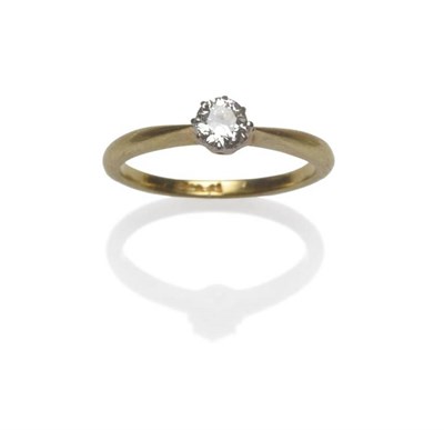 Lot 1029 - A Diamond Solitaire Ring, an old cut diamond in a white claw setting, to a yellow tapered...