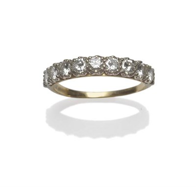 Lot 1031 - A Diamond Half Eternity Ring, nine round brilliant cut diamonds in white claw settings on a...