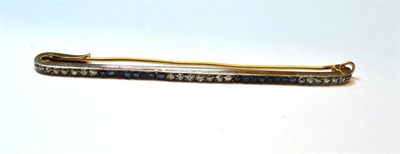 Lot 1033 - An Early 20th Century Diamond and Sapphire Bar Brooch, alternating series of calibre   cut...