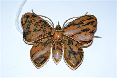 Lot 1038 - A Moss Agate Butterfly Brooch, the brown toned stones in yellow claw and bezel settings,...