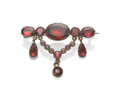 Lot 1040 - A 19th Century Garnet Swag Brooch, the foil backed stones in yellow claw and millegrain closed back