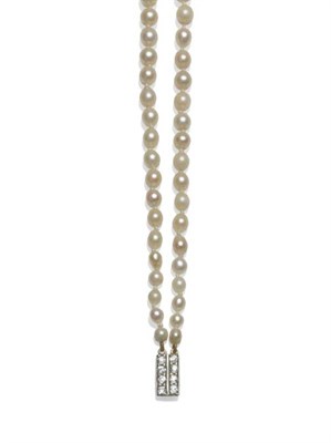 Lot 1042 - A Cultured Pearl Two Row Necklace, the slightly off round graduated pearls knotted to an oblong...