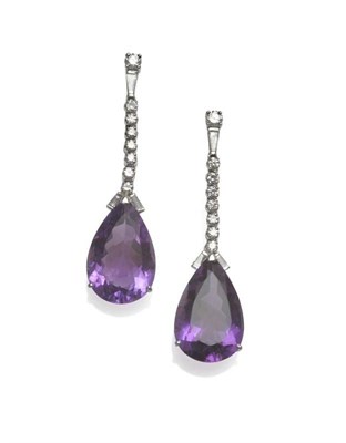 Lot 1063 - A Pair of 18 Carat White Gold Amethyst and Diamond Drop Earrings, a string of round brilliant...