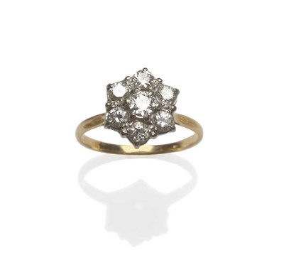 Lot 1064 - A Diamond Cluster Ring, the old cut and round brilliant cut diamonds arranged in white claw...