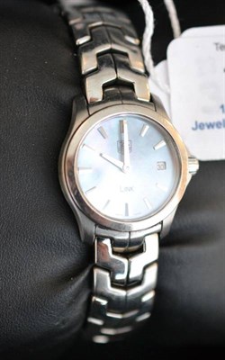 Lot 1070 - A Lady's Stainless Steel Calendar Wristwatch, signed Tag Heuer, Model: Link, circa 2009, quartz...