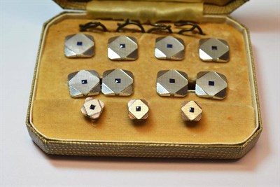 Lot 1080 - A Set of 9 Carat White Gold Dress Studs, of square form, with canted corners, a mother-of-pearl...