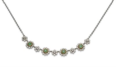 Lot 1086 - An 18 Carat White Gold Emerald and Diamond Necklace, clusters of round brilliant cut diamonds...