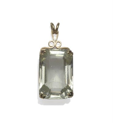 Lot 1097 - An Aquamarine Pendant, the light green oblong step cut stone with truncated corners, in a...