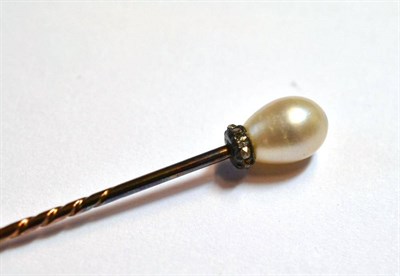 Lot 1104 - A Pearl and Diamond Stick Pin, the drop shaped pearl above a row of rose cut diamonds, on a pin...