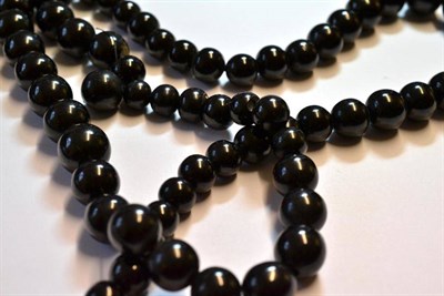 Lot 1107 - Two Jet Bead Necklaces, each of graduated spherical beads, lengths 42cm and 69cm approximately