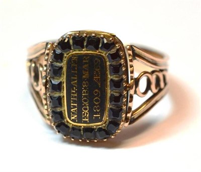 Lot 1111 - A Cornelian and Jet Swivel Mourning Ring, the oblong head enamelled in black centrally, to read...