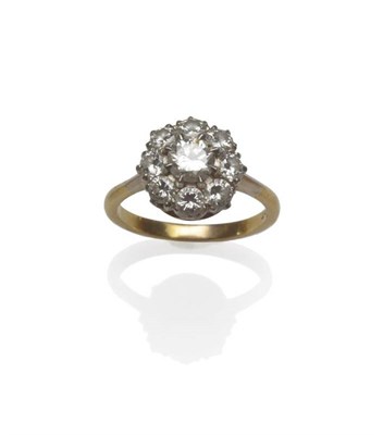 Lot 1118 - A Diamond Cluster Ring, a central brilliant cut diamond within a border of eight smaller, in...