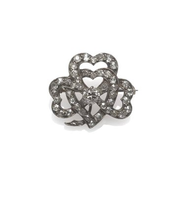 Lot 1122 - A Late Victorian Diamond Brooch, as entwined hearts, diamond set throughout, with a larger stone to