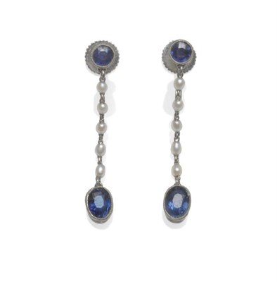 Lot 1123 - A Pair of Early 20th Century Sapphire and Seed Pearl Earrings, a round cut sapphire to a string...