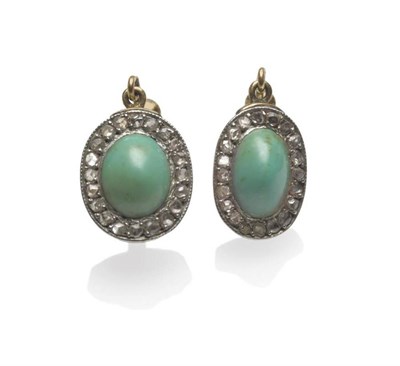 Lot 1124 - A Pair of Early 20th Century Turquoise and Diamond Earrings, each comprises an oval cabochon...