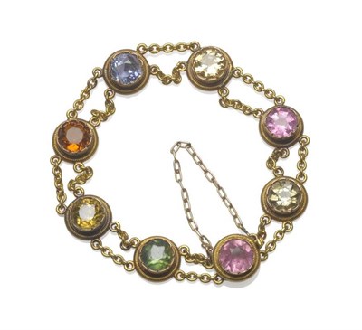 Lot 1127 - A Multi Gem Bracelet, circa 1910, the round cut stones of mixed colour tourmaline, citrine and...